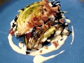 Blackened Hispi cabbage with aged parmesan and baco